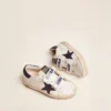 Old School Junior in white leather with blue suede star and heel tab