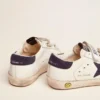 Old School Junior in white leather with blue suede star and heel tab