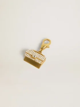 Purse-shaped charm in gold-colored brass with crystals
