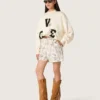 Women's shorts in black and white cotton poplin with floral print