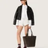 Women's oversized shirt in white cotton with pleated detail and jewel buttons