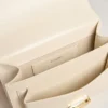 Venezia Bag in butter-colored boarded leather with double charm
