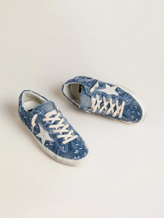 Women's Super-Star LTD in light blue denim with a white leather star and embroidered flowers