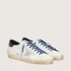 Women’s Super-Star LTD in white leather with suede star and blue leather heel tab